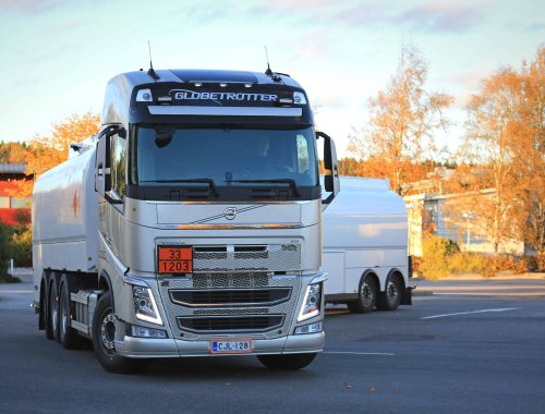 SALO, FINLAND - OCTOBER 1, 2016: New white Volvo FH fuel tank truck in city of Salo. The ADR code 33-1203 signifies gasoline.